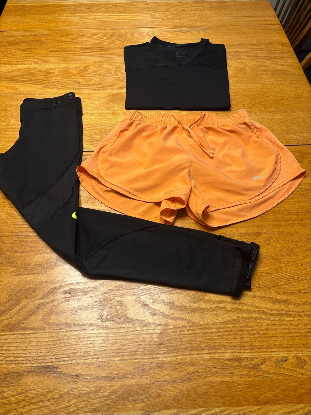 Nike Orange Women’s Athletic Shorts with Black Leggings and Top - Picture 2 of 12